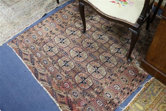 A Bokhara red ground rug and two Persian rugs (worn)